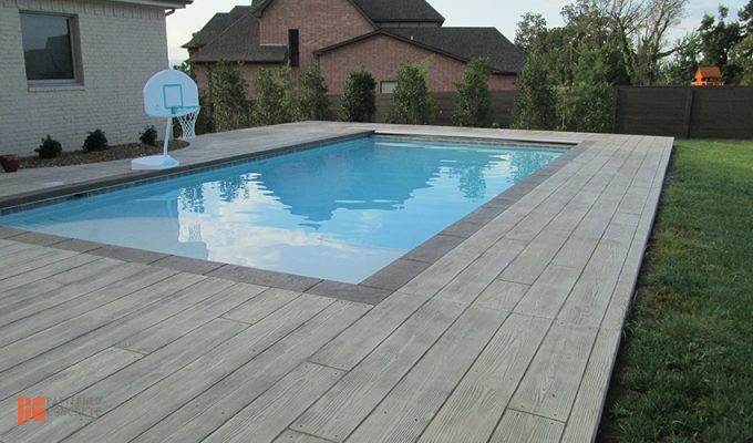Stamped concrete decking around a pool