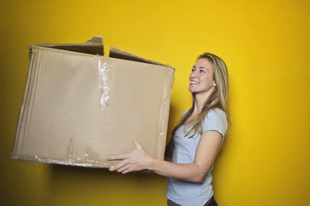 Lady moving a large box